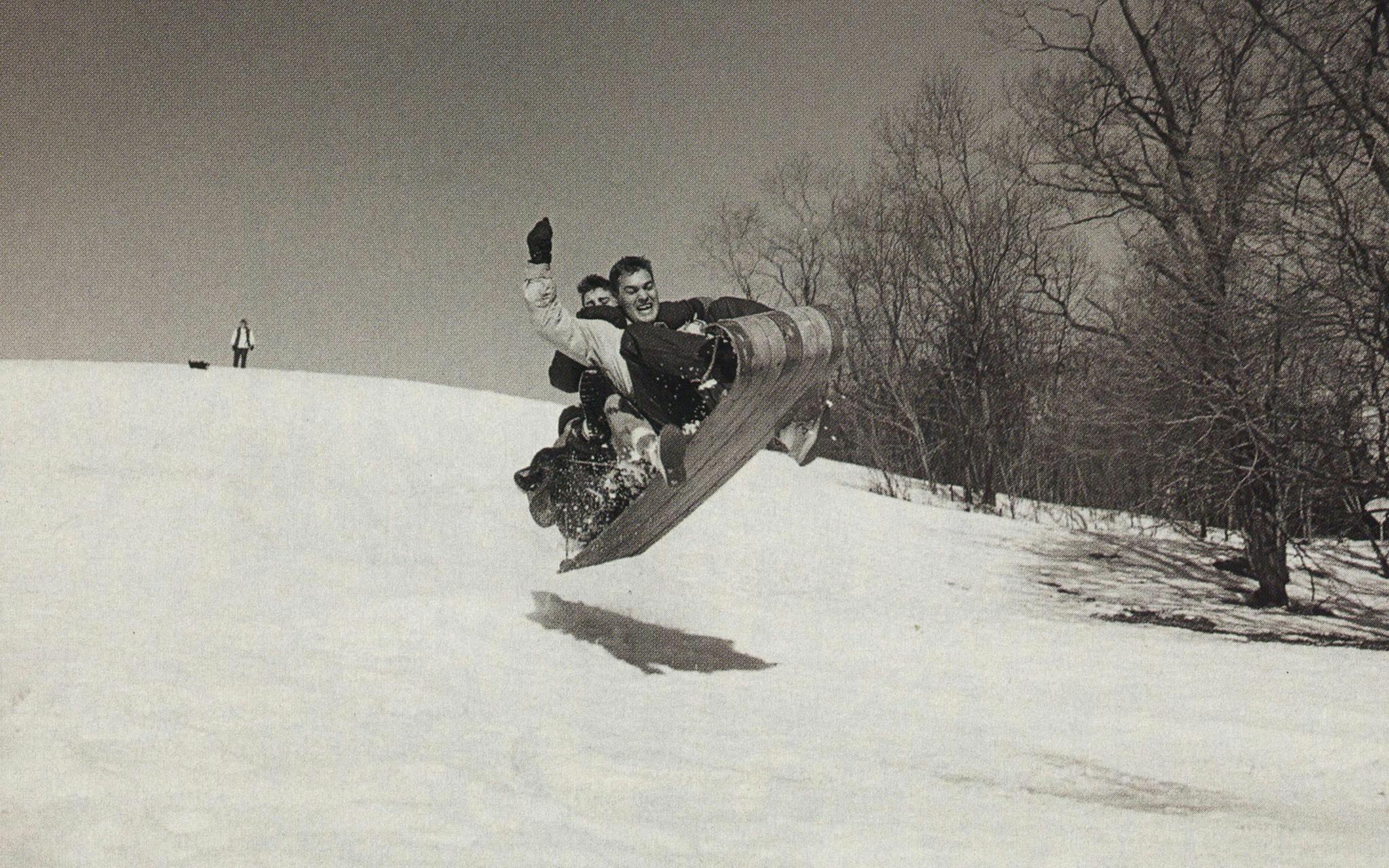 Andrew and Luke Wilson on an air-born sled.