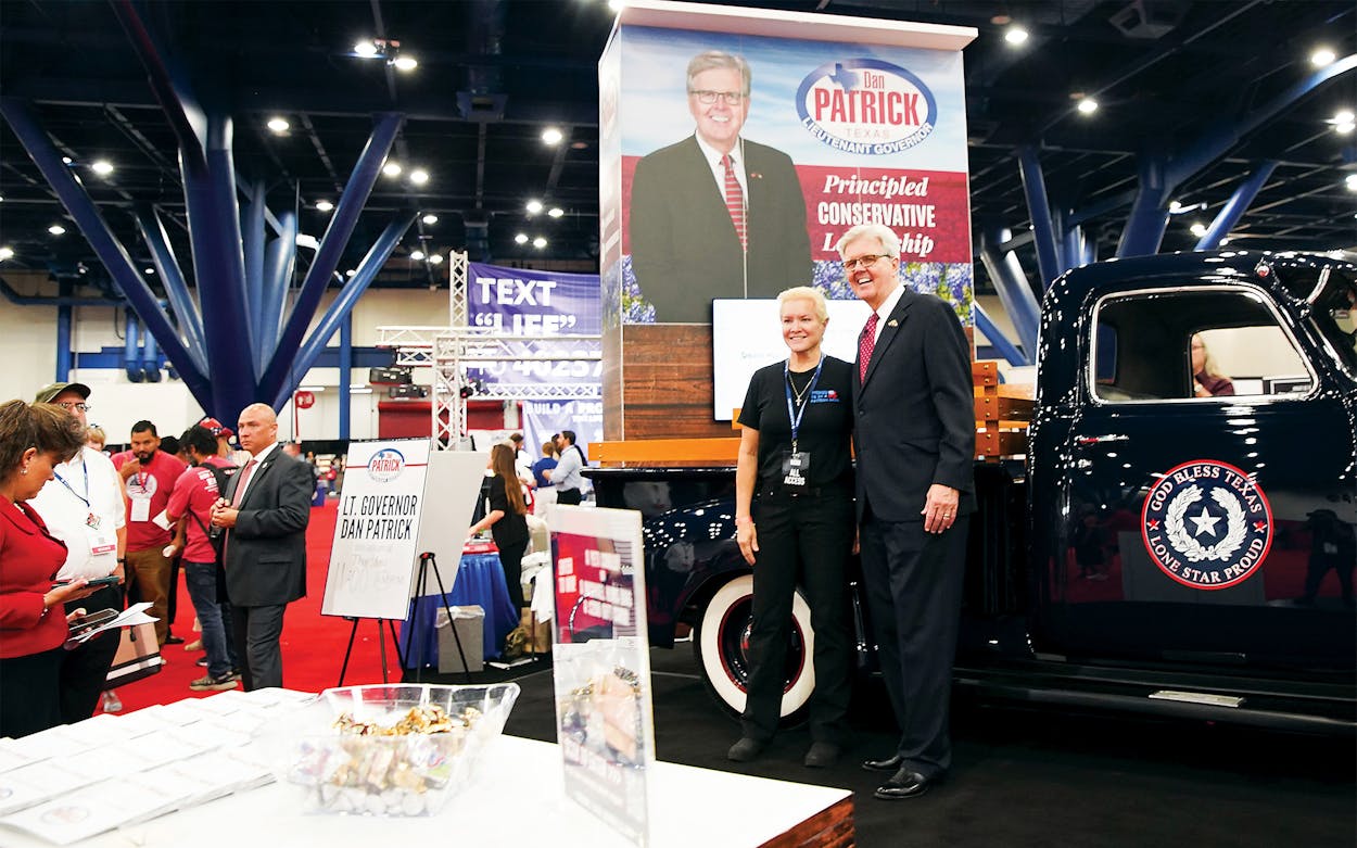 Texas Lieutenant Governor Dan Patrick poses for photos with supporters in front of his pickup truck during the first day of the Republican Party of Texas convention at George R. Brown Convention Center in Houston on June 15, 2022.