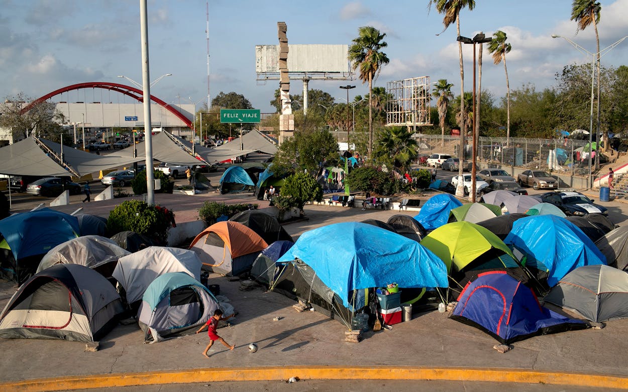 A camp for asylum seekers stands next to the international bridge to the United States on December 09, 2019 in Matamoros, Mexico. More than 1,000 Central American and Mexican asylum seekers have been staying, many for months between immigration court hearings, in a squalid camp in Matamoros, across the border from Brownsville, Texas. Immigrant families seeking asylum are now required by the U.S. government to stay in Mexico as part of the Trump Administration's 