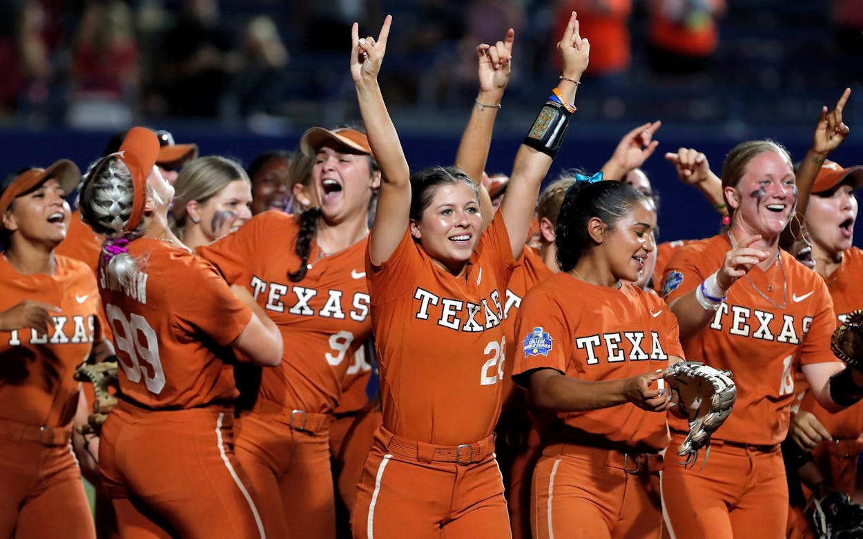 Texas players celebrate after defeating Oklahoma State during an NCAA softball Women's College World Series game on Monday, June 6, 2022, in Oklahoma City. Texas won 6-5.