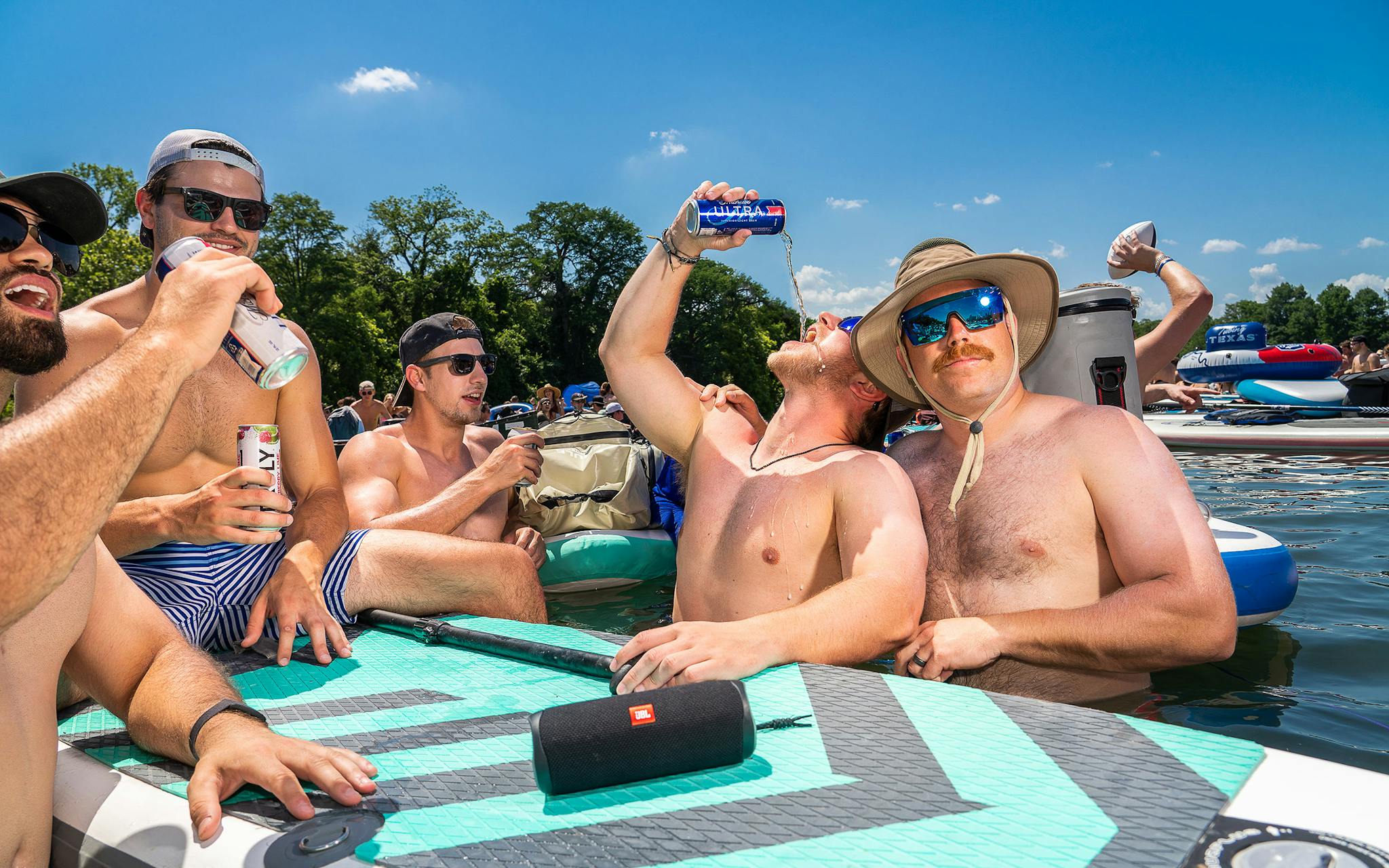 Men drinking beer on Lady Bird Lake.