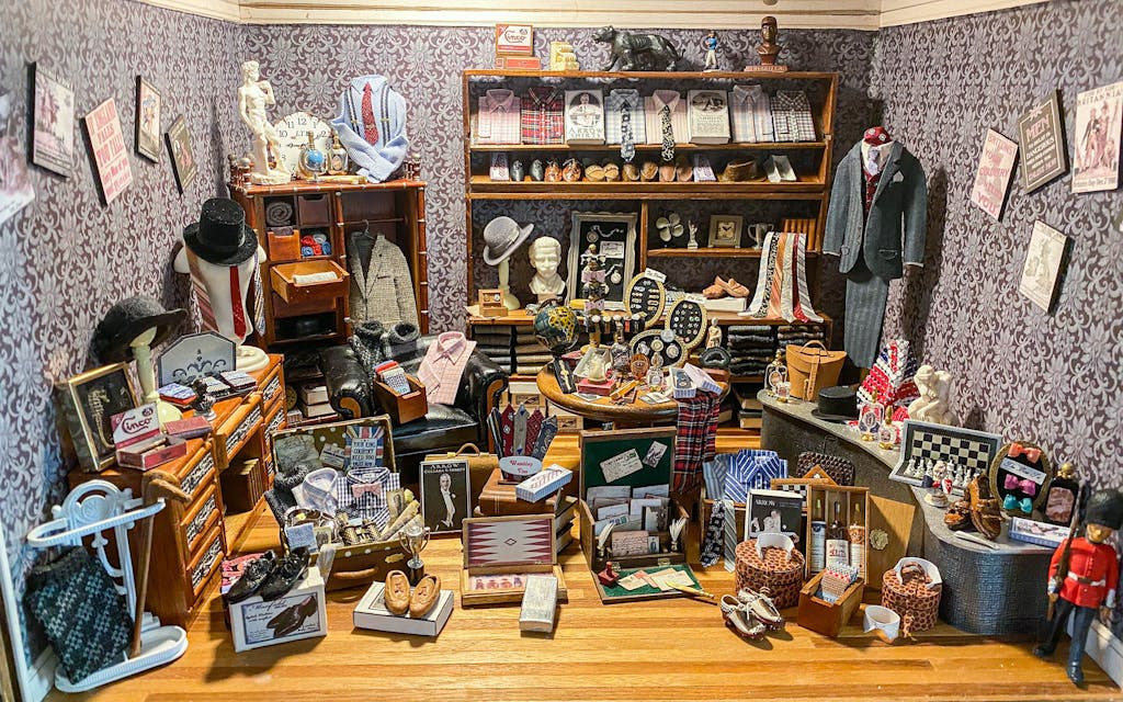 Manrig made this miniature men’s clothing shop with tiny men’s suits and turtlenecks made out of socks.