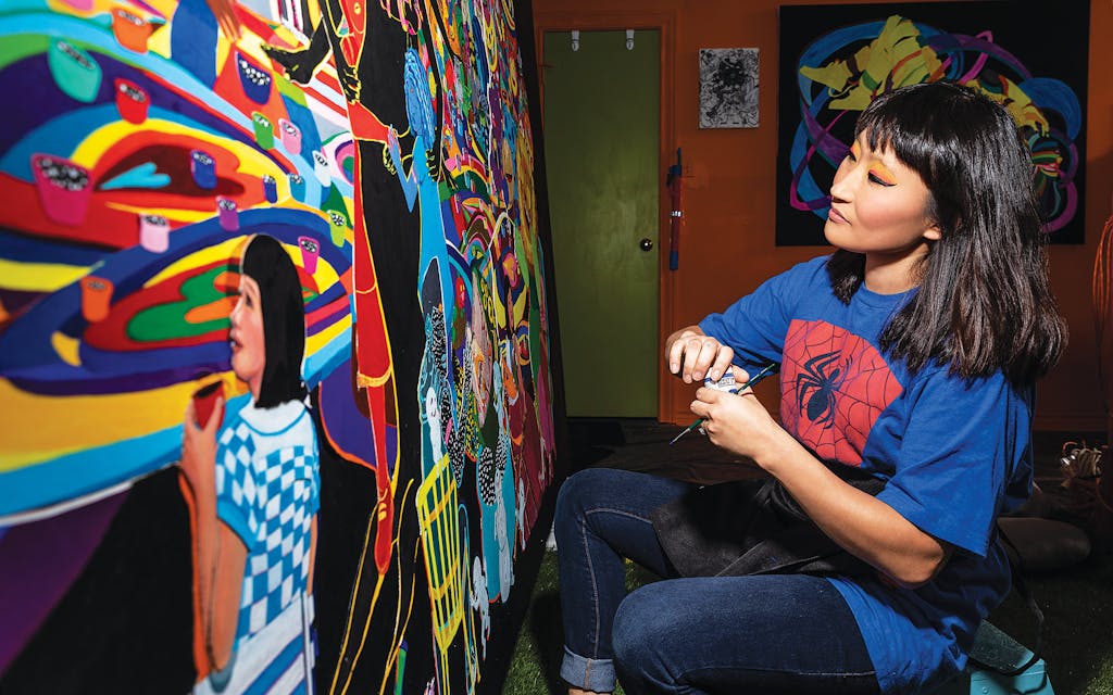 Choi working on the painting The Table of Love in her studio.