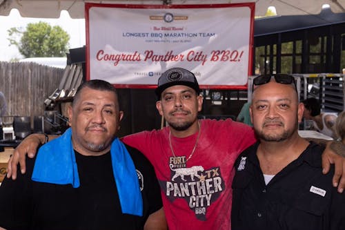 Chris Magallanes, Ernie Morales, and Mark Montemayor after breaking the Guinness World Records for the Longest BBQ Marathon