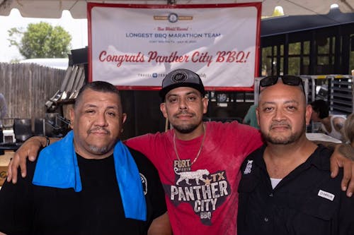 Chris Magallanes, Ernie Morales, and Mark Montemayor after breaking the Guinness World Records for the Longest BBQ Marathon