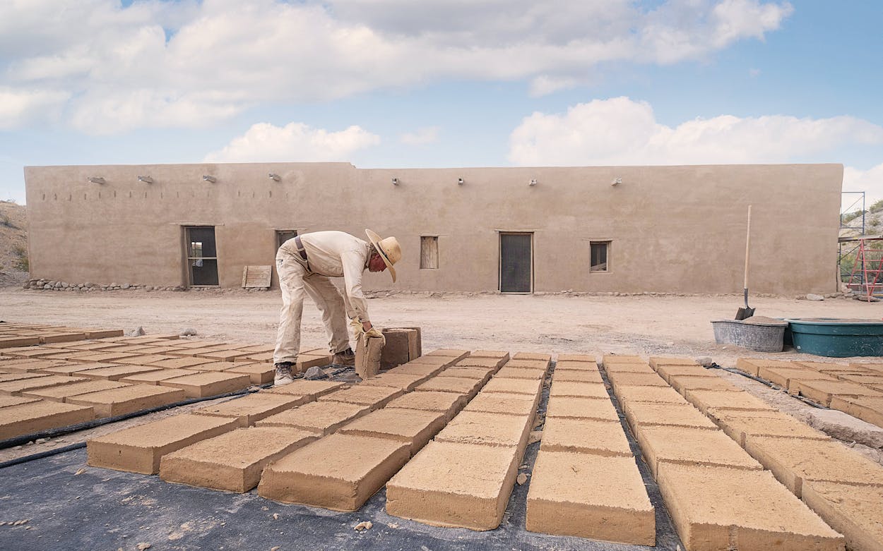 David Keller sets up adobe bricks to dry in Big Bend National Park in 2021.