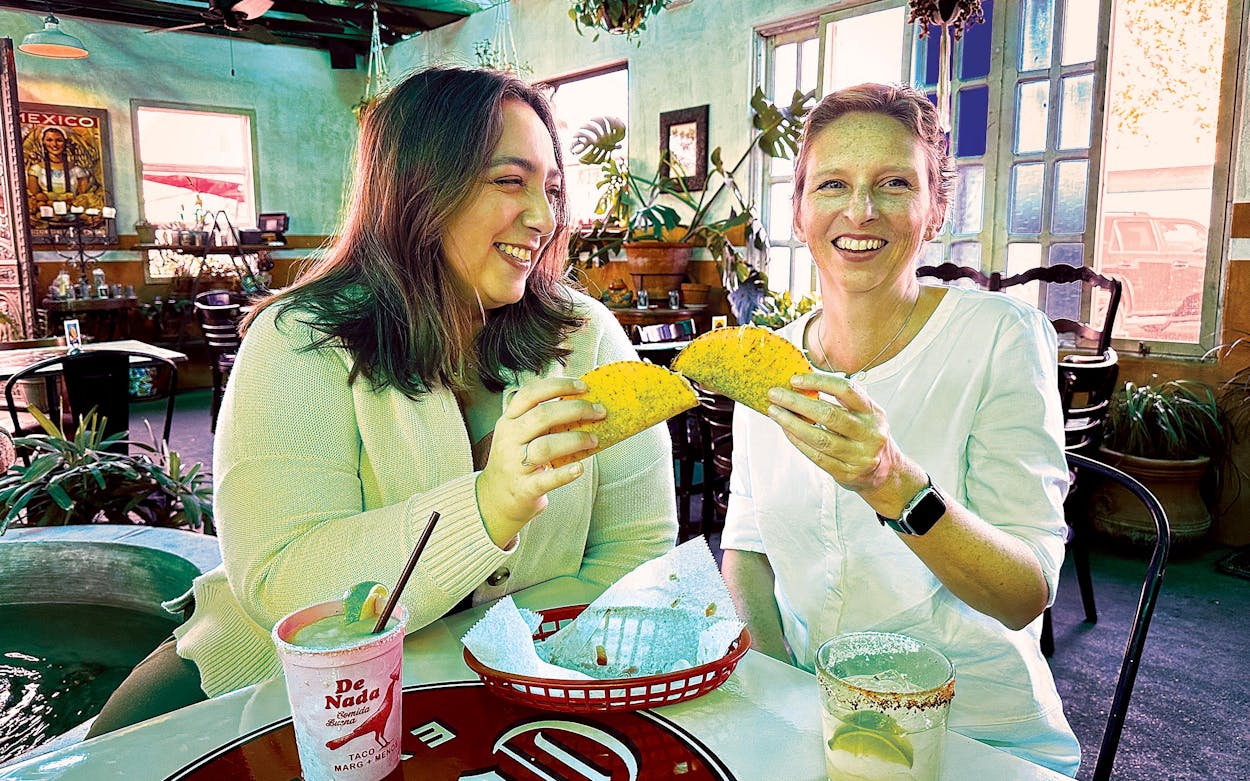 Associate editor Kimya Kavehkar and executive editor Courtney Bond share a basket of crispy beef tacos at De Nada Cantina, in Austin.