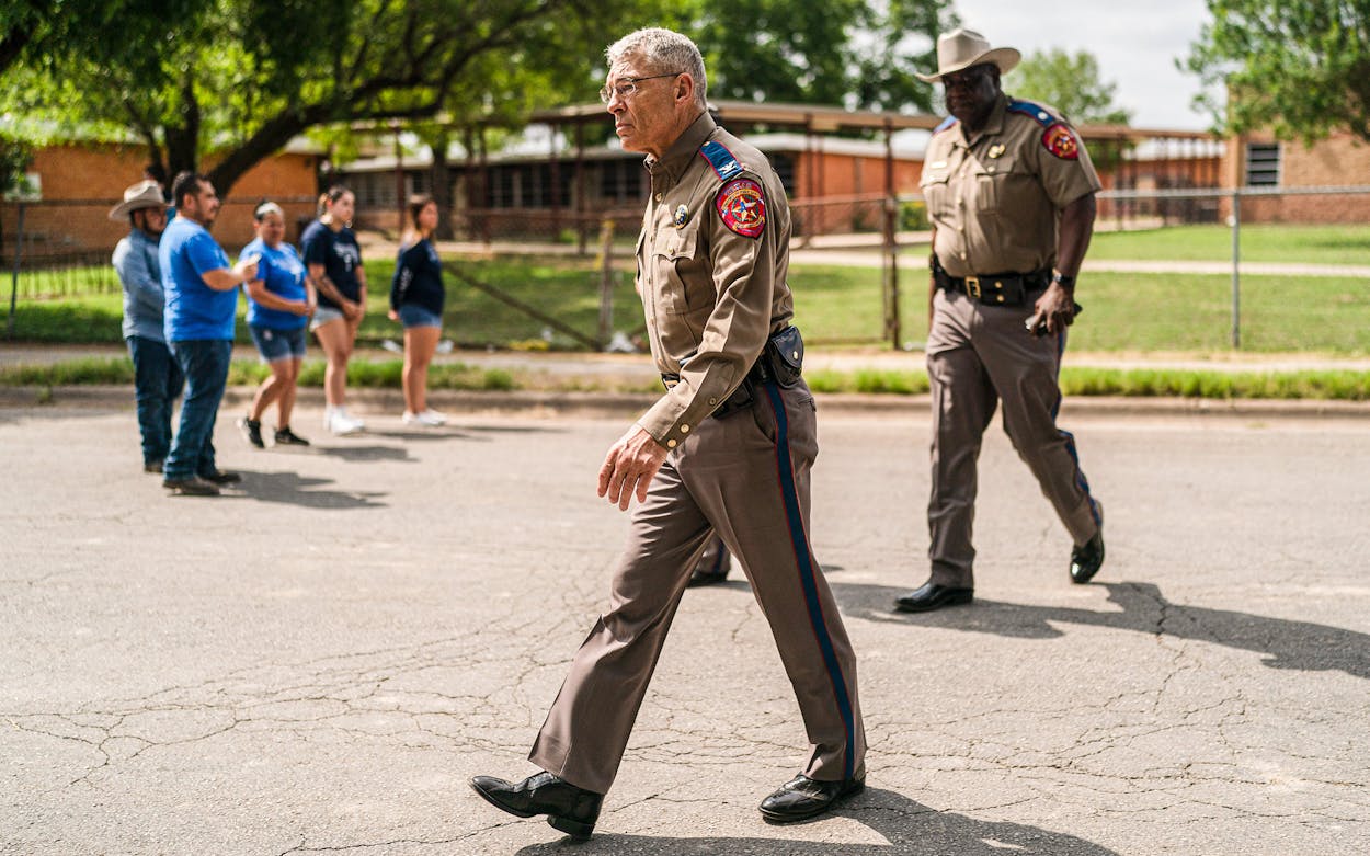 Texas Department of Public Safety Director Steven McCraw walks along the street outside Robb Elementary School in Uvalde on May 30, 2022.