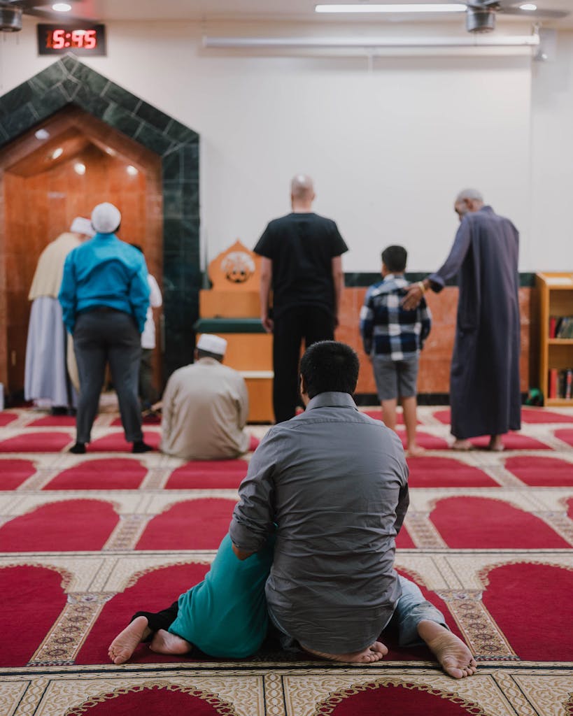 Men and their sons during mid day prayers at the ISGH Masjid Attaqwa, a mosque that is part of the Islamic Society of Greater Houston, along Synott Road in Sugar Land, on September 22, 2022.