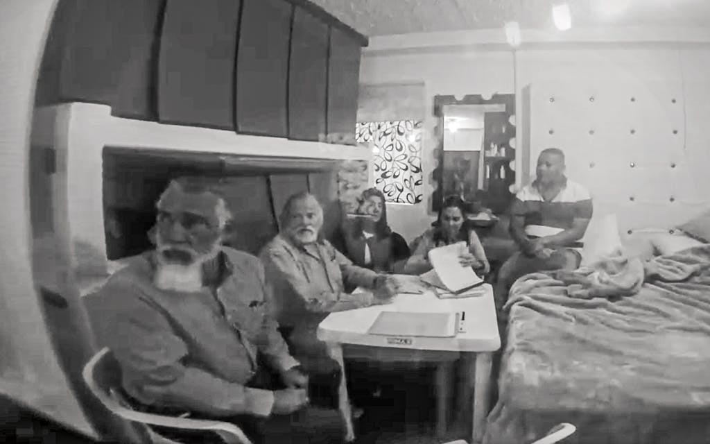 At La Picota prison, in Colombia (left to right) Jamie Balagia, Chuck Morgan, Adriana Morgan, Bibiana Correa, and Segundo Villota Segura meeting in Villota’s cell.