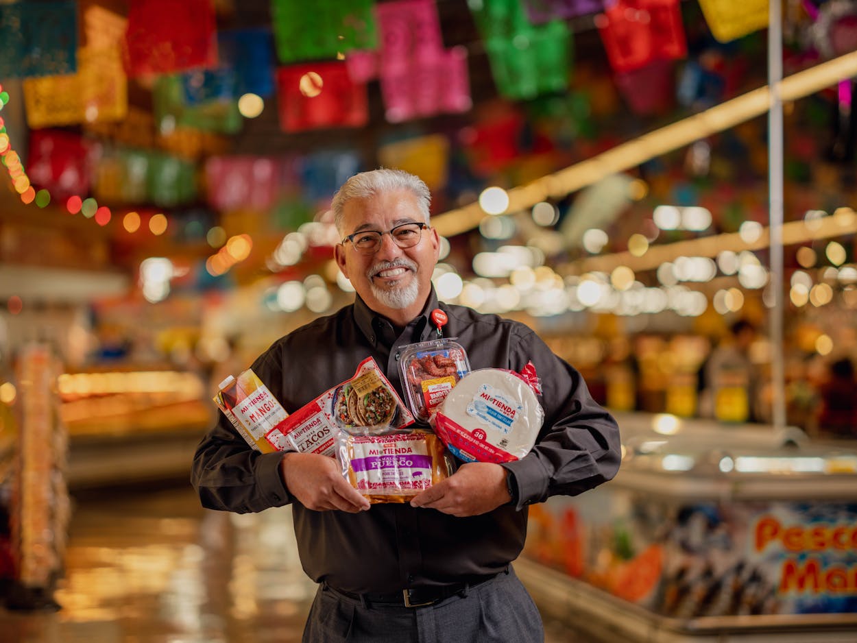 H-E-B Partner Juan Alonso displays some Mi Tienda products, like tamales, tortillas, and more.