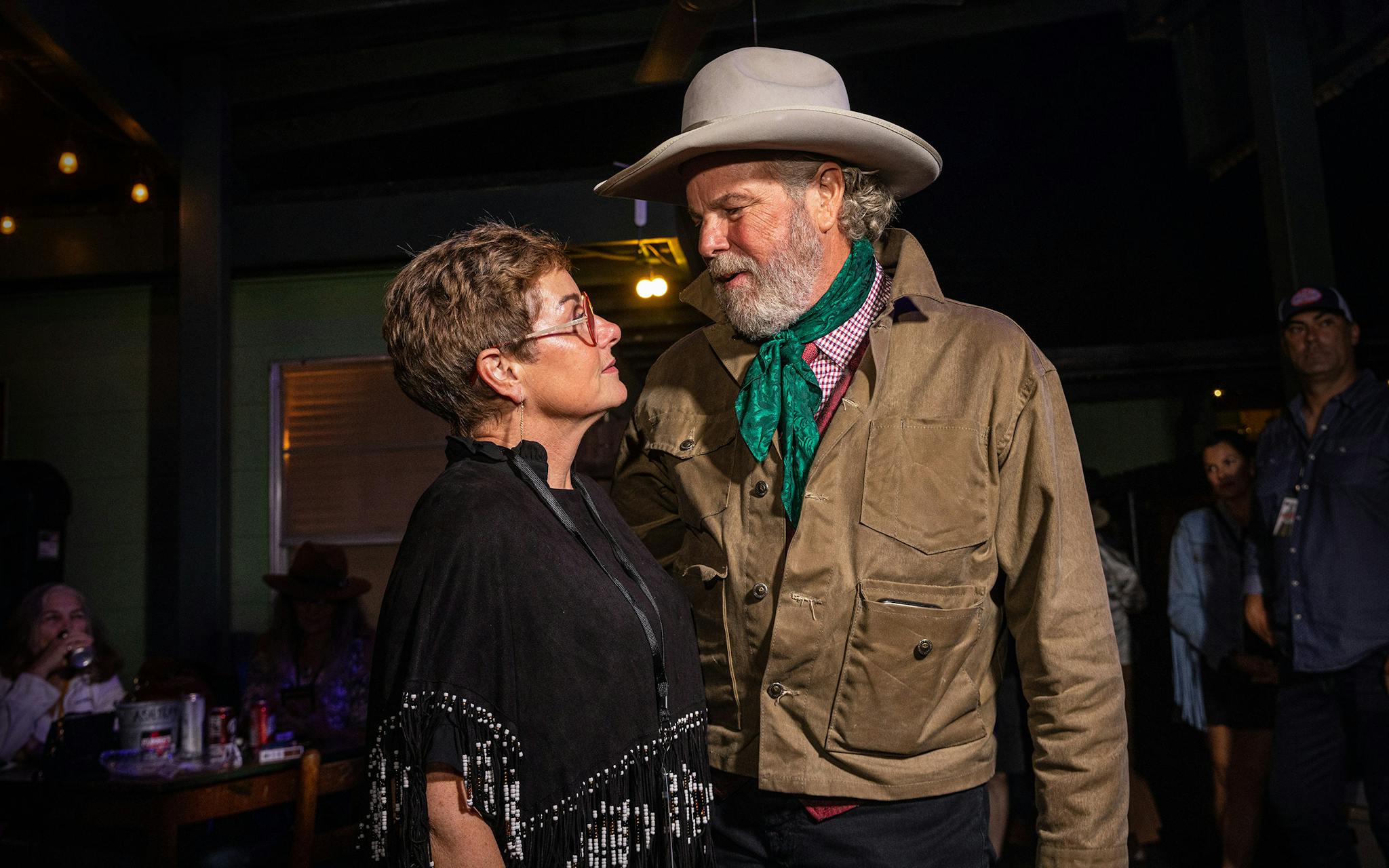 Robert Earl Keen and his wife Kathleen Keen talk before he takes the stage at John T. Floore’s Country Store in Helotes, Texas, for his second to last show on Sept. 3, 2022.