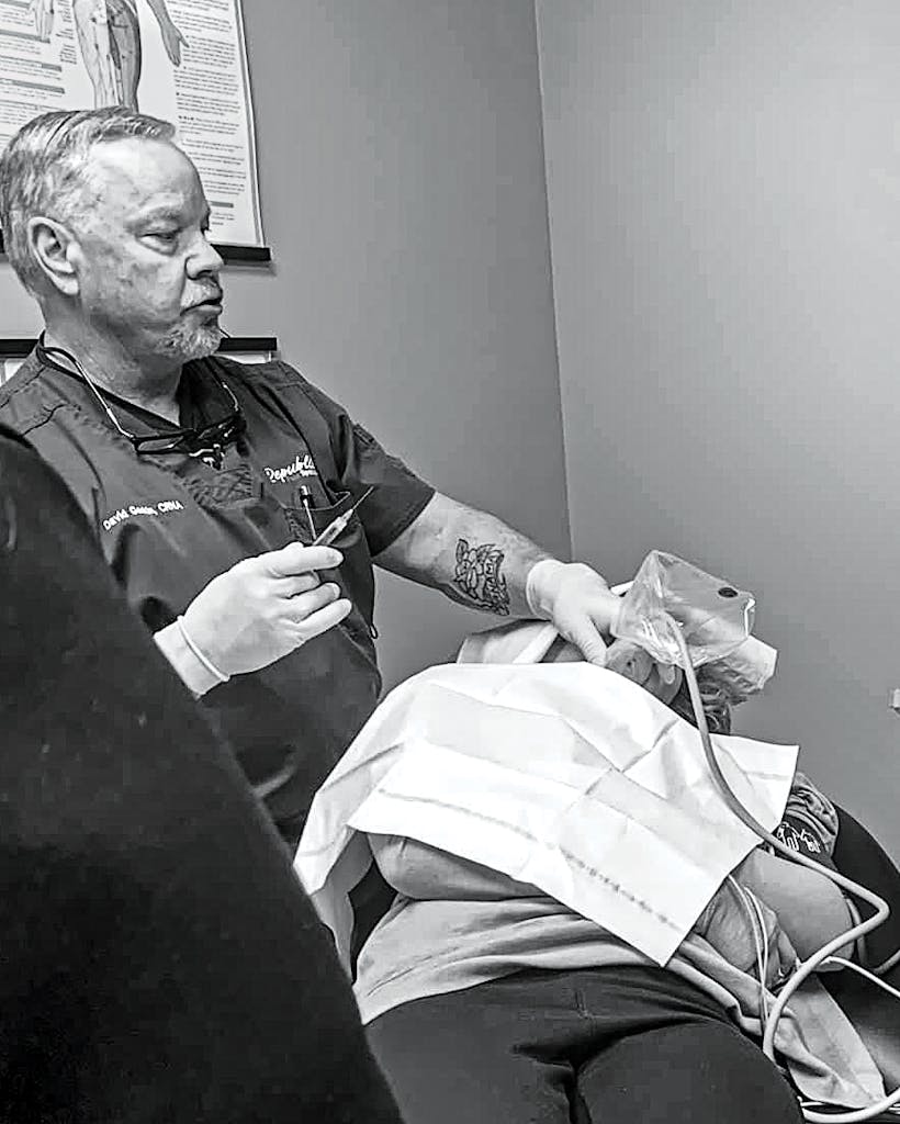 David Gaskin performs a stellate ganglion block on a patient at Republic Pain Specialists, in Bryan.
