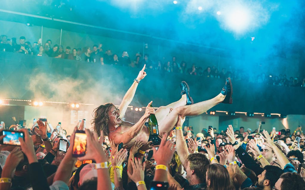 Rebillet crowd-surfs over fans during a show in Brooklyn on October 11, 2022.