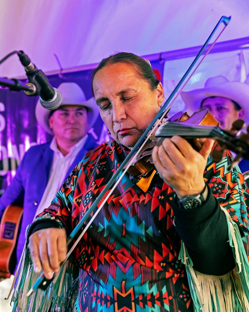 Belén Escobedo plays her fiddle at the Festival of Texas Fiddling at Twin Sisters Dancehall in Blanco on December 3, 2022.