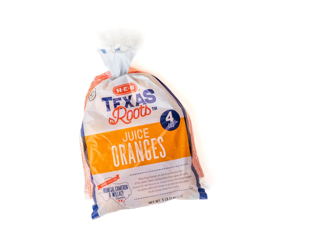 A bag of H-E-B Texas Roots oranges.
