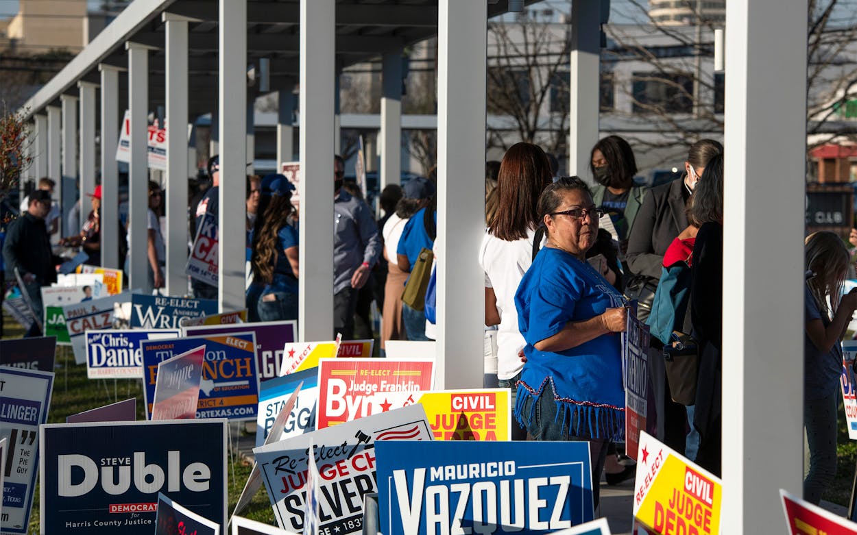 Voters wait in line outside of the Metropolitan Multi-Service Center polling place in Houston on March 1, 2022.