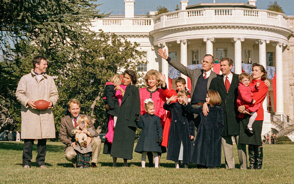 U.S. President George Bush poses with some of his children and grandchildren on the White House lawn, in Washington, D.C., on January 21, 1989. Seen from left are: Jeb Bush, Neil Bush with Pierce, Margaret Bush holding Marshall, Sharon Bush and Lauren, Noelle, Barbara and Jenna, the president, George W. Bush, and Dorothy LeBlond holding Ellie.
