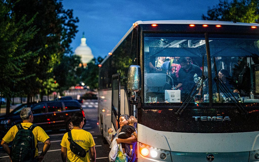 Migrants disembark a bus from Texas within view of the U.S. Capitol on August 11, 2022 in Washington, DC.