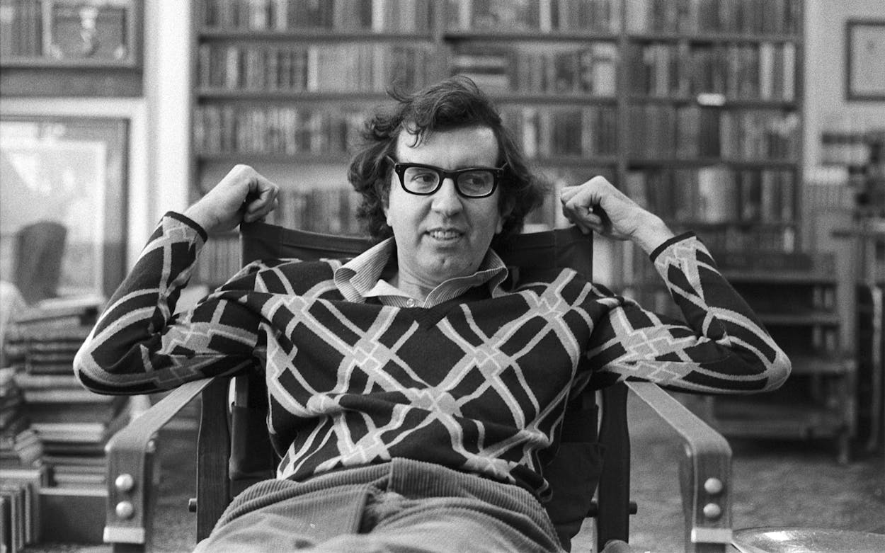 Author Larry McMurtry (1936 - 2021) as he sits in his bookstore, Booked Up, in the late 1970s.
