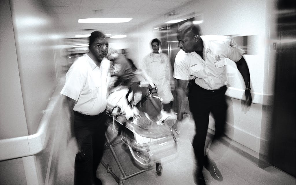 Paramedics moving a gunshot-wound patient at Ben Taub Hospital, in Houston, in May 1993.