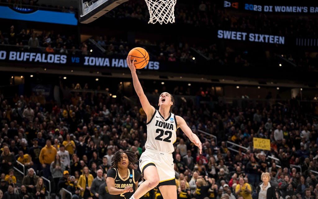 Iowa guard Caitlin Clark (22) goes up for a layup against Colorado guard Tameiya Sadler during the second half of a Sweet 16 college basketball game of the NCAA tournament, Friday, March 24, 2023, in Seattle. Clark was honored Thursday, March 30, as The Associated Press women's college basketball Player of the Year.
