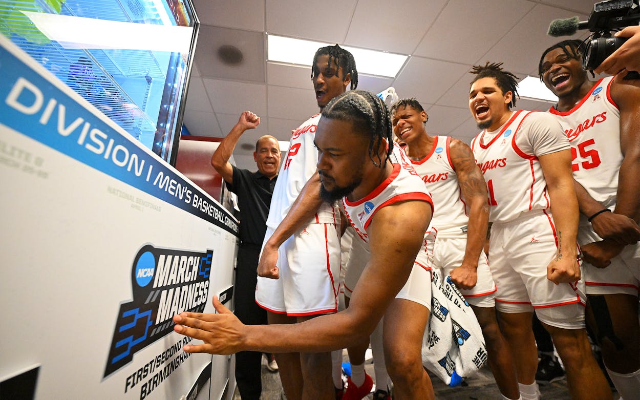 The Houston Cougars celebrate after their win against the Auburn Tigers during the second round of the 2023 NCAA Men's Basketball Tournament held at Legacy Arena at the BJCC on March 18, 2023.