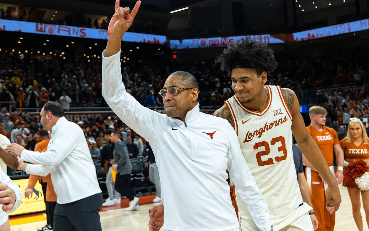 Texas interim head coach Rodney Terry and forward Dillon Mitchell celebrate a win against Baylor during an NCAA college basketball game Monday, Jan. 30, 2023, in Austin.