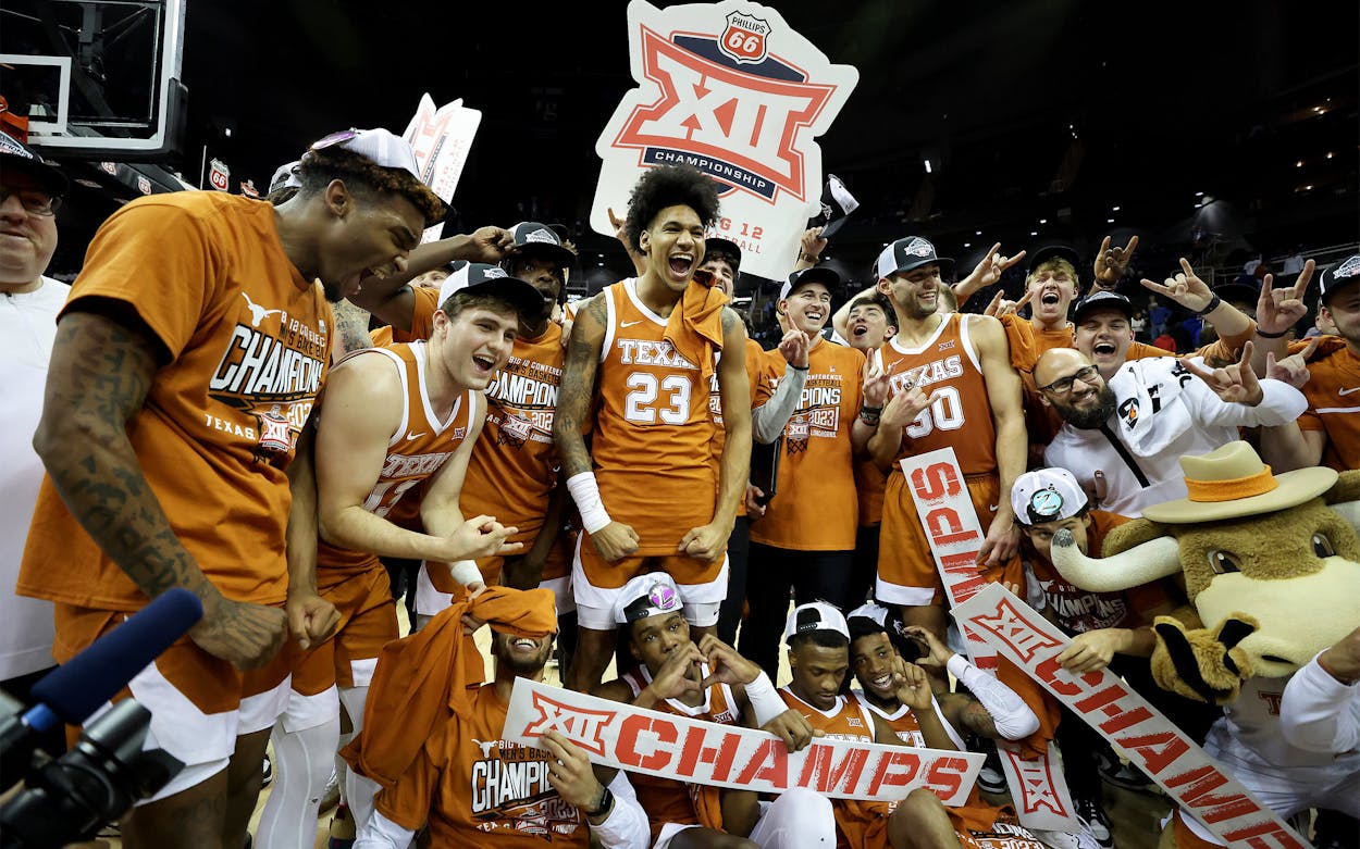 Texas Longhorns celebrate after defeating the Kansas Jayhawks in the Big 12 Tournament Championship game at T-Mobile Center on March 11, 2023 in Kansas City, Missouri.