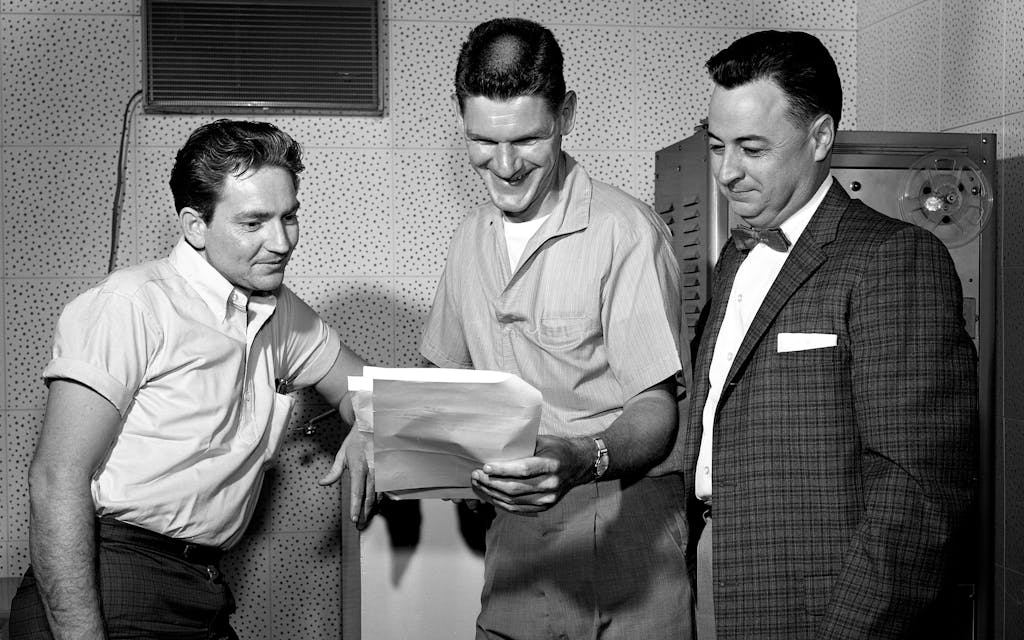 Willie Nelson (left) and fellow songwriter Harlan Howard with their boss Hal Smith, the owner of the Pamper Music publishing company, on July 15, 1961.