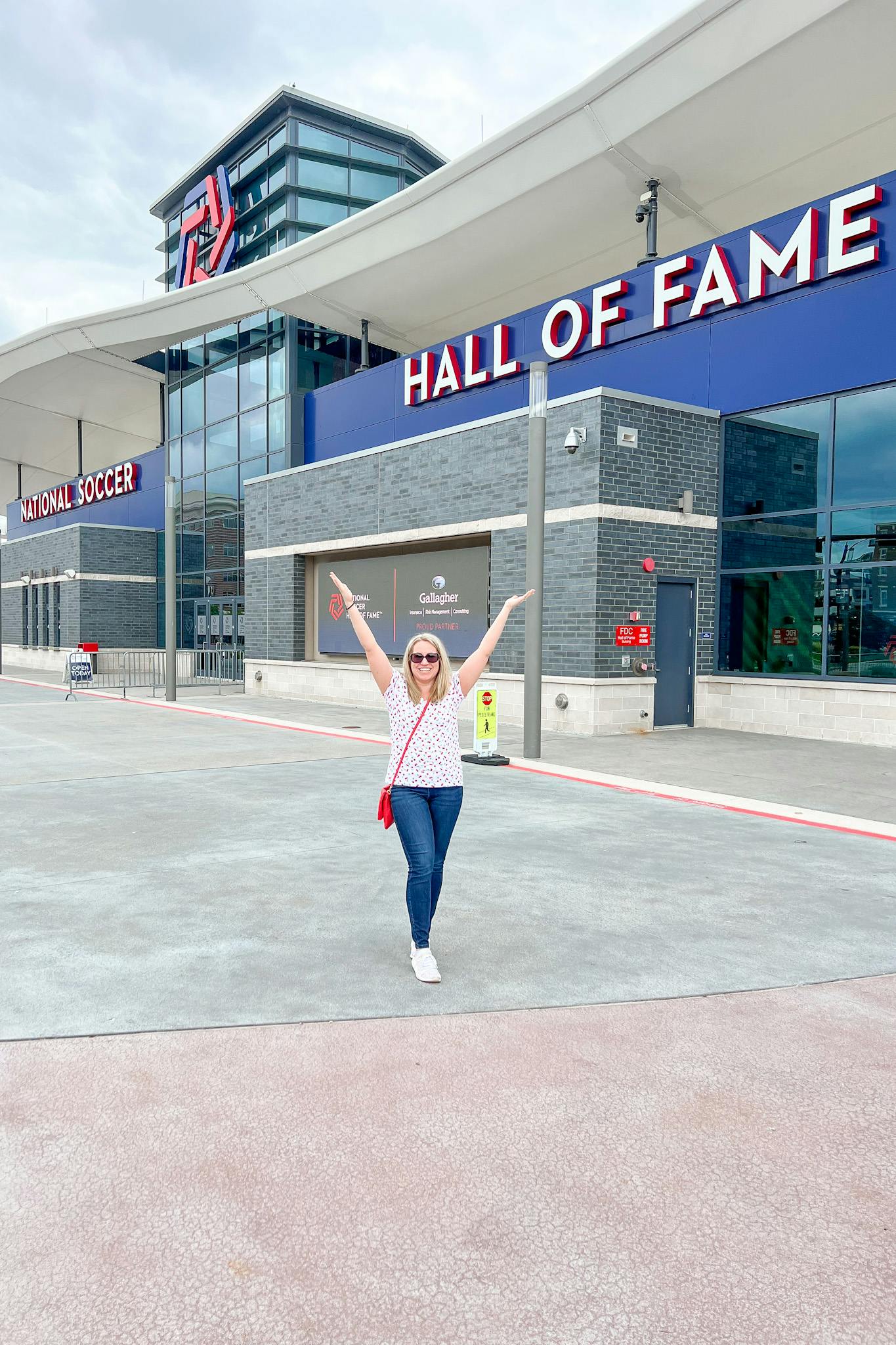 The Soccer Mom poses in front of the Soccer Hall of Fame.