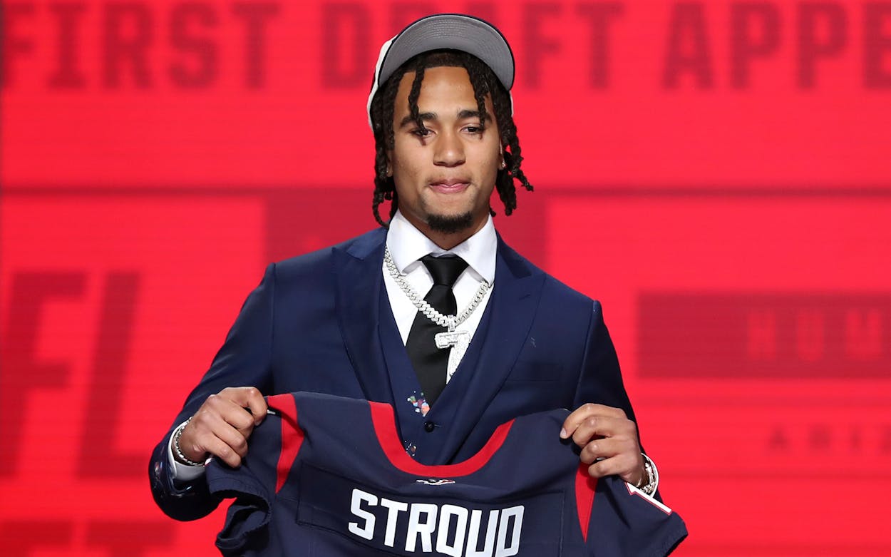 Ohio State quarterback C.J. Stroud with a jersey after being drafted in the first round of the NFL Draft on April 27, 2023 at Union Station in Kansas City, MO.
