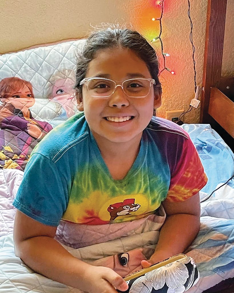 Lexi Rubio in 2021, age 9, wearing her newly prescribed glasses.