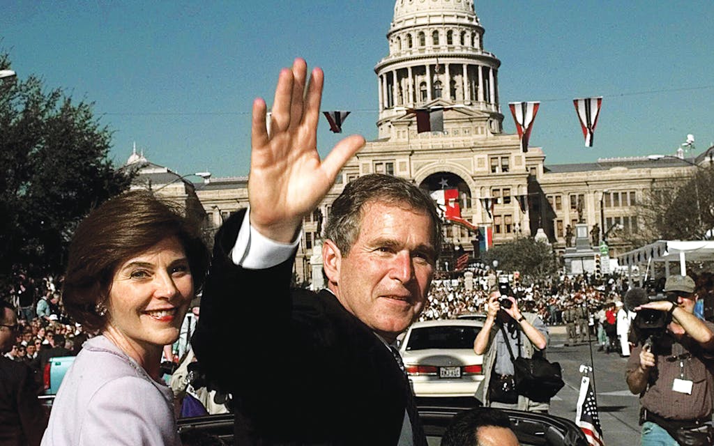 George W. Bush and his wife, Laura, at his second inaugural parade on January 19, 1999.