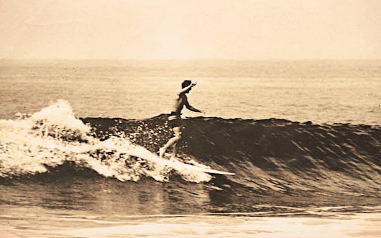 A surfer on a Blaker board in the late sixties.