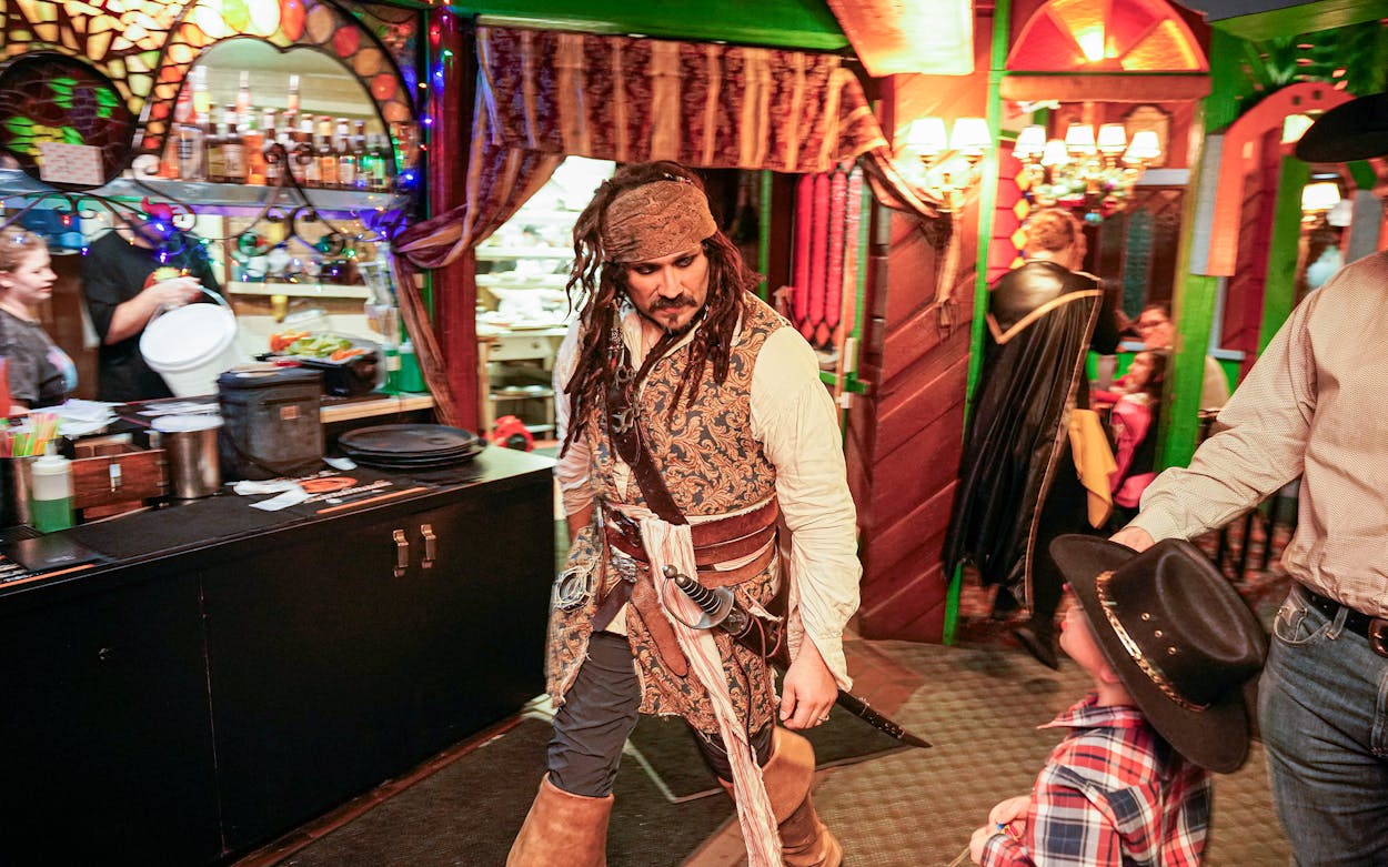 A restaurant employee dressed as Captain Jack Sparrow at the Magic Time Machine.