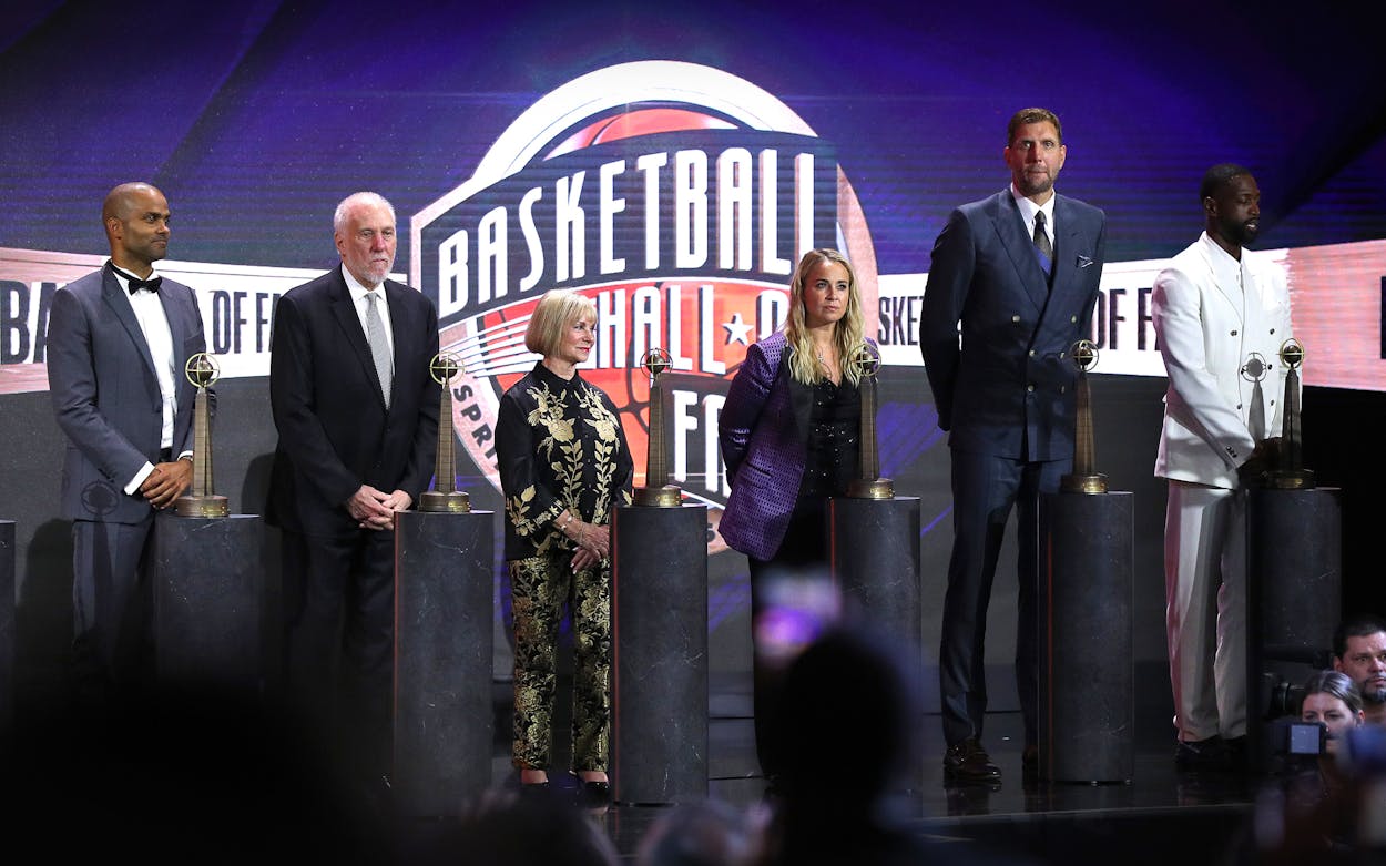 2023 inductees Tony Parker, Gregg Popovich, Becky Hammon, Dirk Nowitzki and Dwyane Wade react on stage during the 2023 Naismith Basketball Hall of Fame Induction at Symphony Hall on August 12, 2023 in Springfield, Massachusetts.