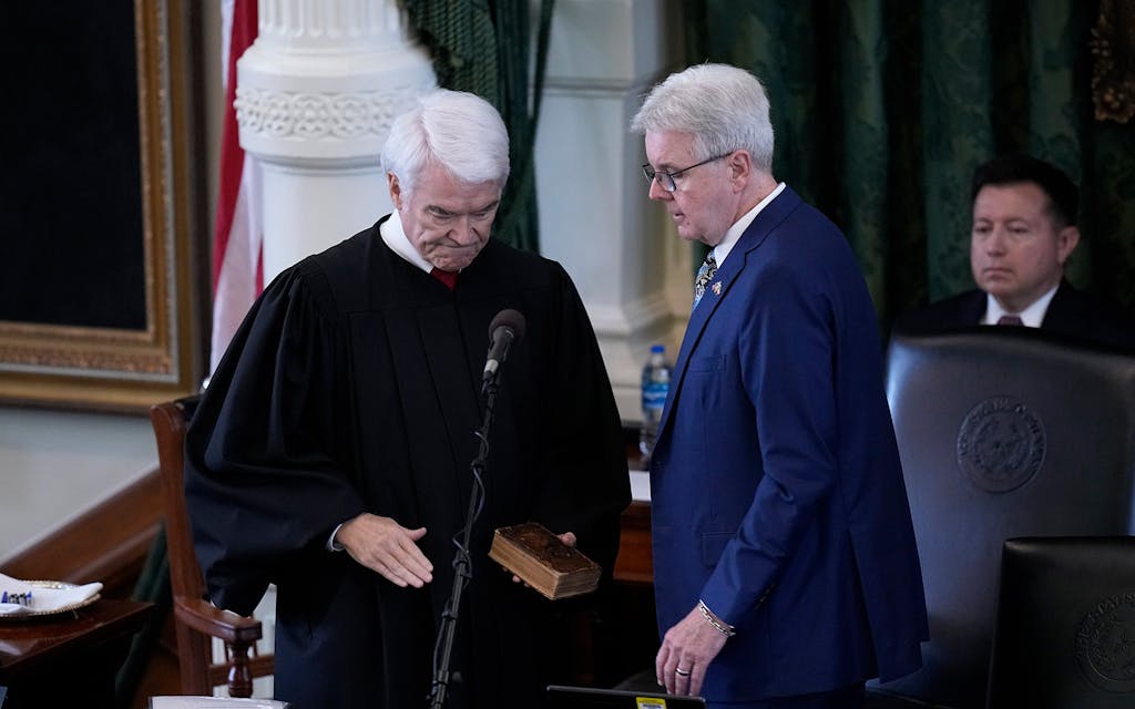 Texas Lt. Gov. Dan Patrick, right, is sworn in by Texas Chief Justice Nathan Hecht, left, during the impeachment trial for Texas Attorney General Ken Paxton in the Senate Chamber at the Texas Capitol, Tuesday, Sept. 5, 2023, in Austin, Texas. 