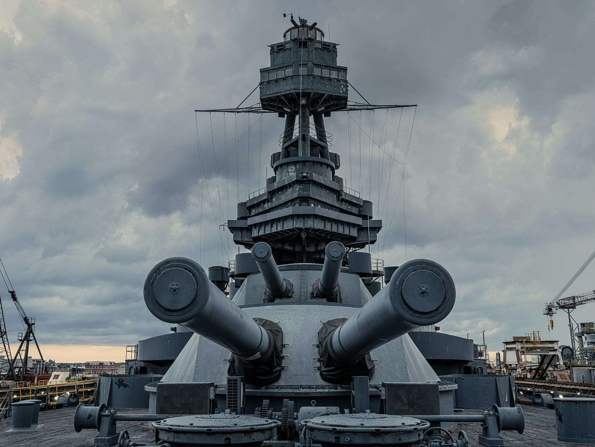 Four of the fourteen-inch guns, whose 1,400-pound shells could travel thirteen miles. The men who aimed and directed the fire were in the foretop, at the top of the photo. During a battle there would be some twenty sailors manning the operation of these massive weapons.