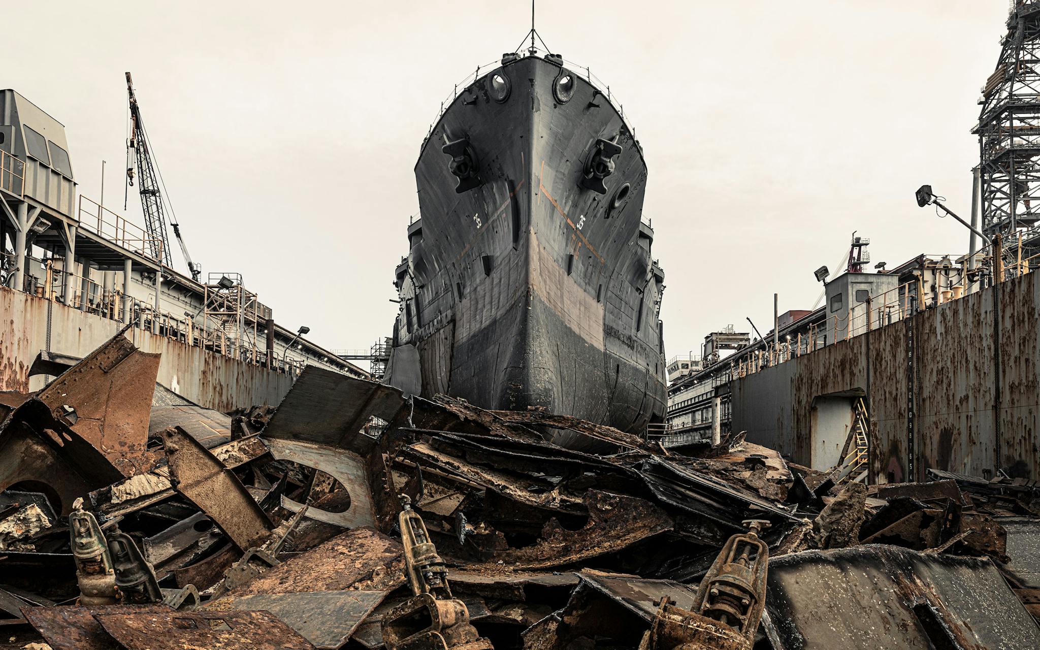 The USS Texas in dry dock earlier this year at the Gulf Copper shipyard, in Galveston. In the foreground are remnants of the ship’s torpedo blisters, first installed in 1925. At the bottom of the photo are the valves that were used to flood these tanks. Each side of the hull was at one time covered with 21 blisters, though they were all scrapped. New blisters are being built at the shipyard.