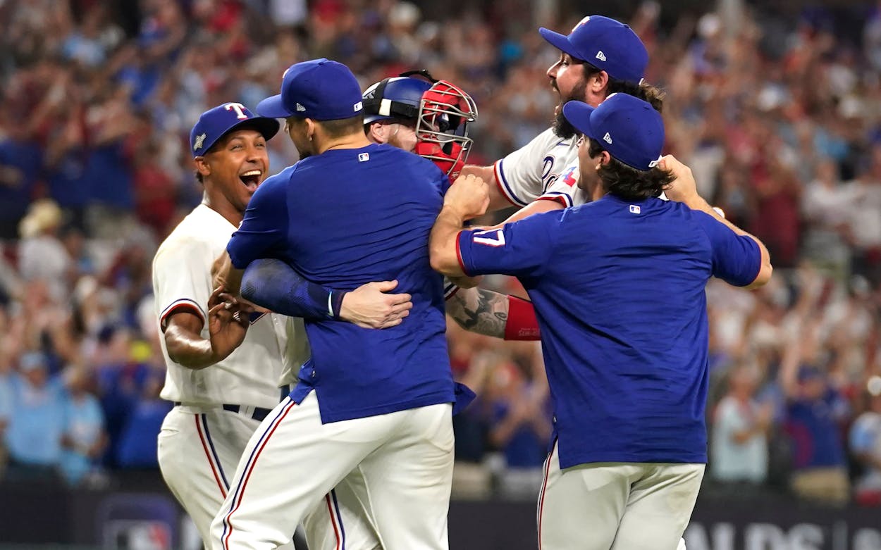 The Texas Rangers celebrate after defeating the Baltimore Orioles in Game 3 of a baseball AL Division Series on Tuesday, Oct. 10, 2023, in Arlington, Texas.