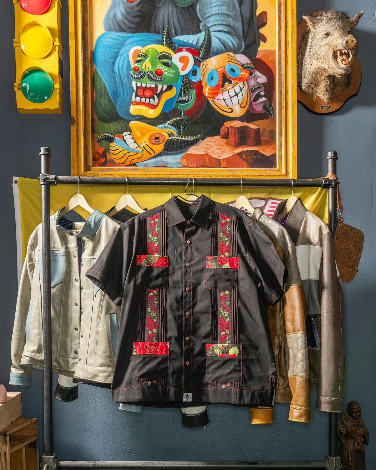 The S.A. Nights guayabera on display among the leather jackets at Divide & Conquer Denim & Leather, in San Antonio.