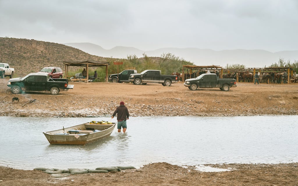 A local man ferries tourists from Big Bend National Park, across the Rio Grande River into Boquillas del Carmen on November 12, 2023.