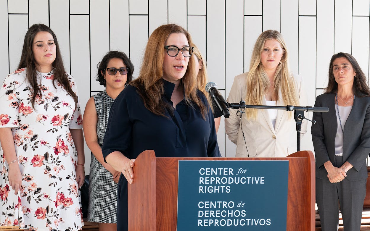 Damla Karsan, a Houston-based OB-GYN (C) speaks during a press conference outside the Travis County Courthouse on July 19, 2023 in Austin, Texas.