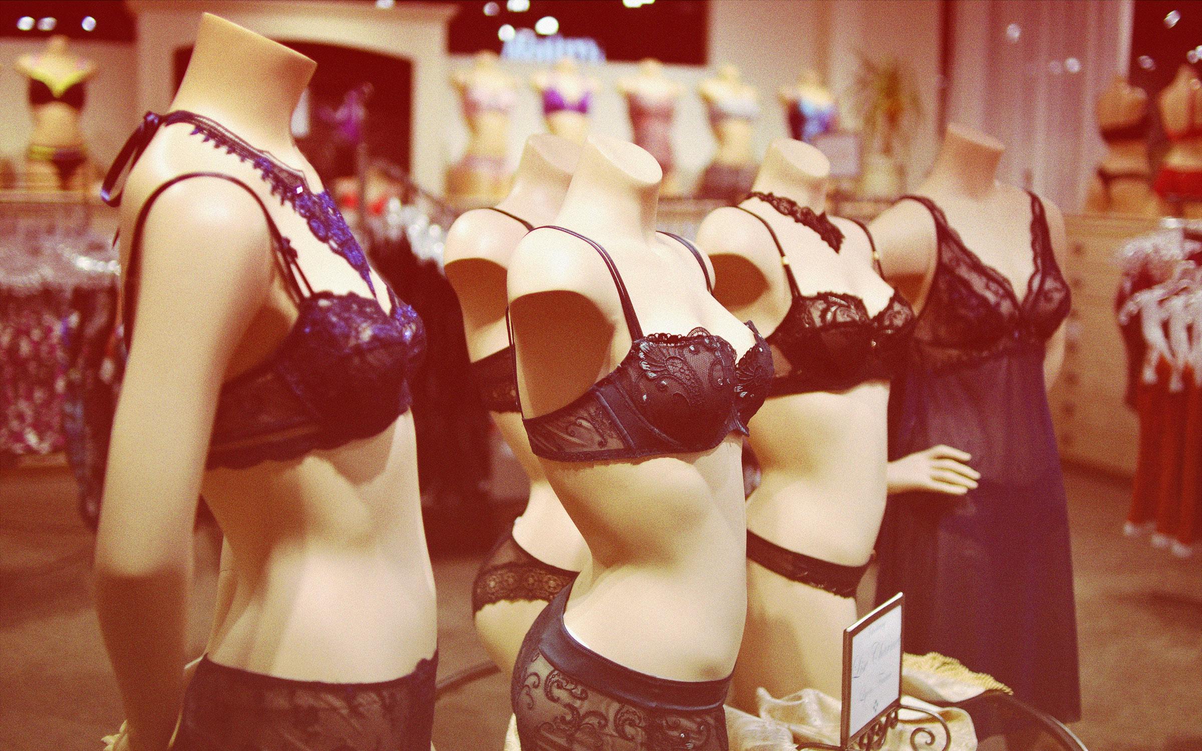 Female mannequins display fashionable lingerie flat style