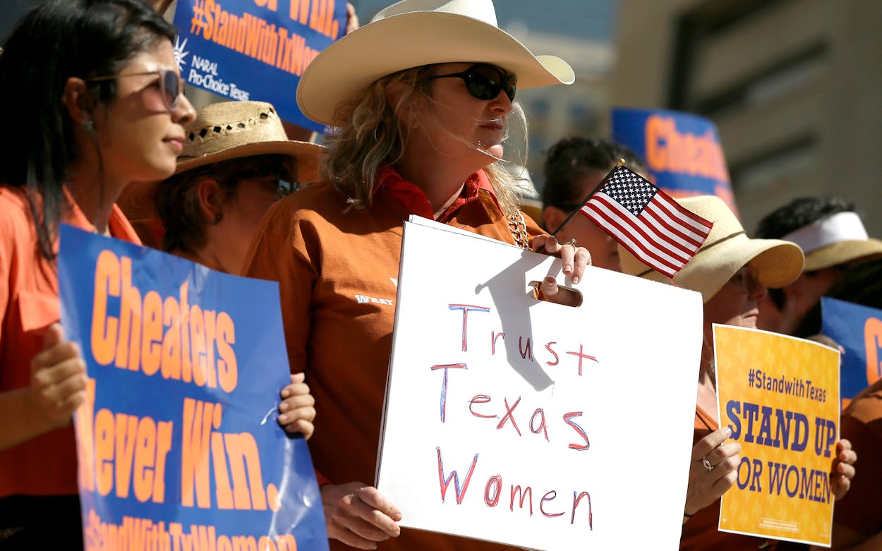supporters at a Planned Parenthood Rally in front of City Hall, Wednesday, July 10, 2013, in Dallas.