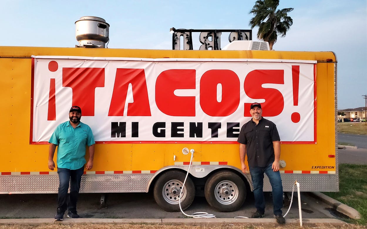 ¡Tacos! Mi Gente owners Navin Chatlani (left) and Jaime Elizondo in front of their new taco trailer.