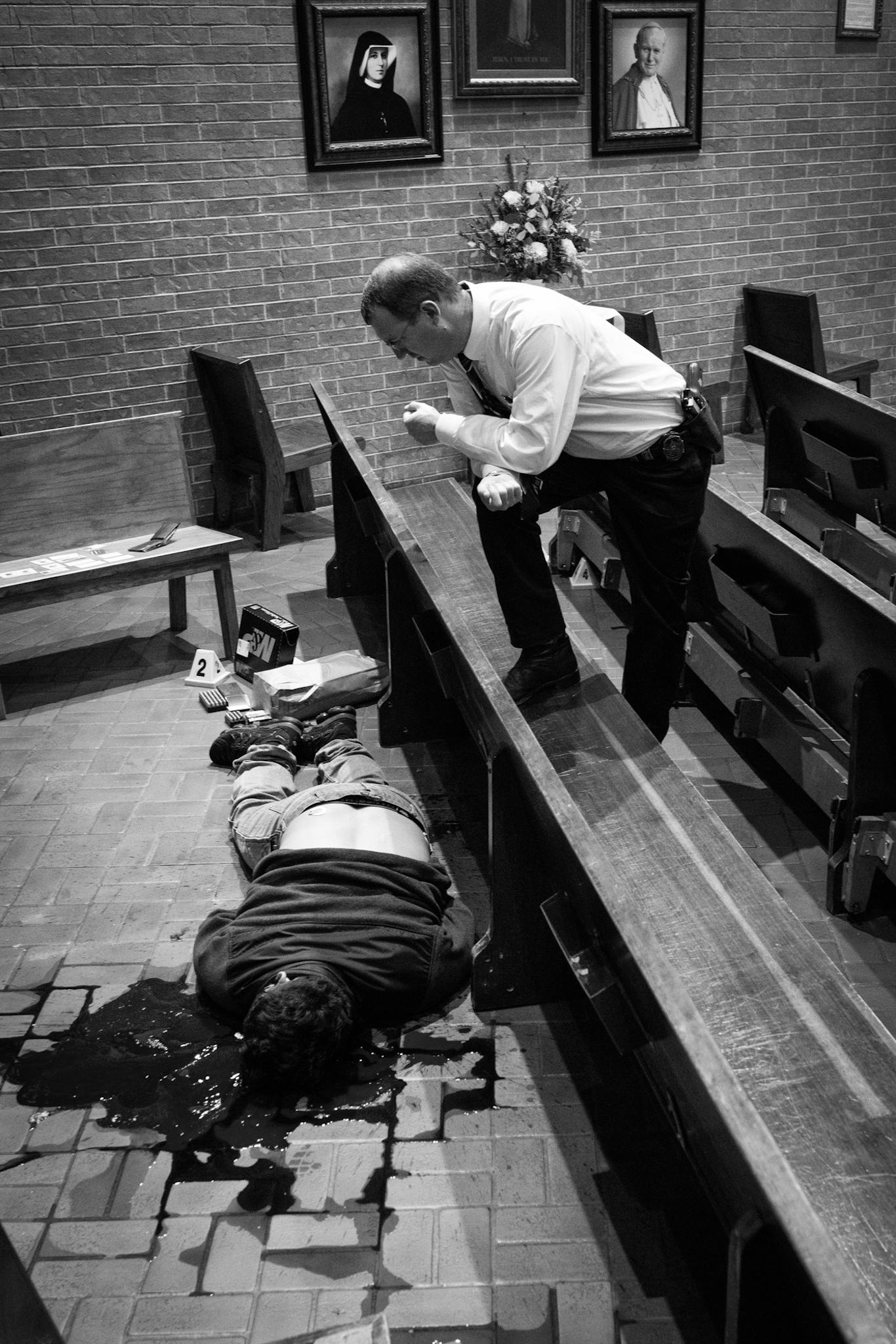 Curtis with a gunshot victim inside a church.