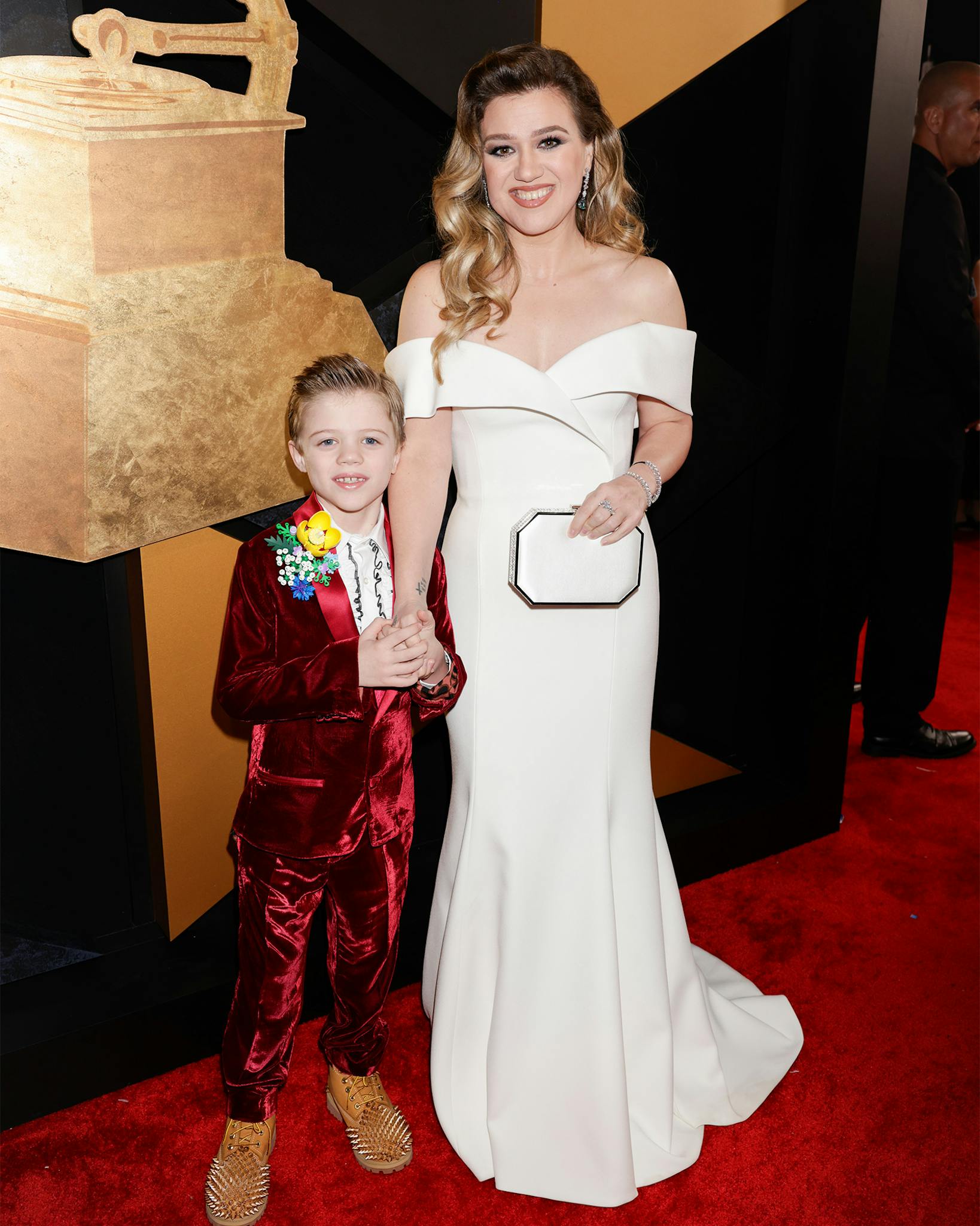 Nominated for best pop vocal album, Kelly Clarkson donned her winners white in an off-the-shoulder classy gown. Although she didn’t win, the star looked content cheering on nominees alongside her son. 