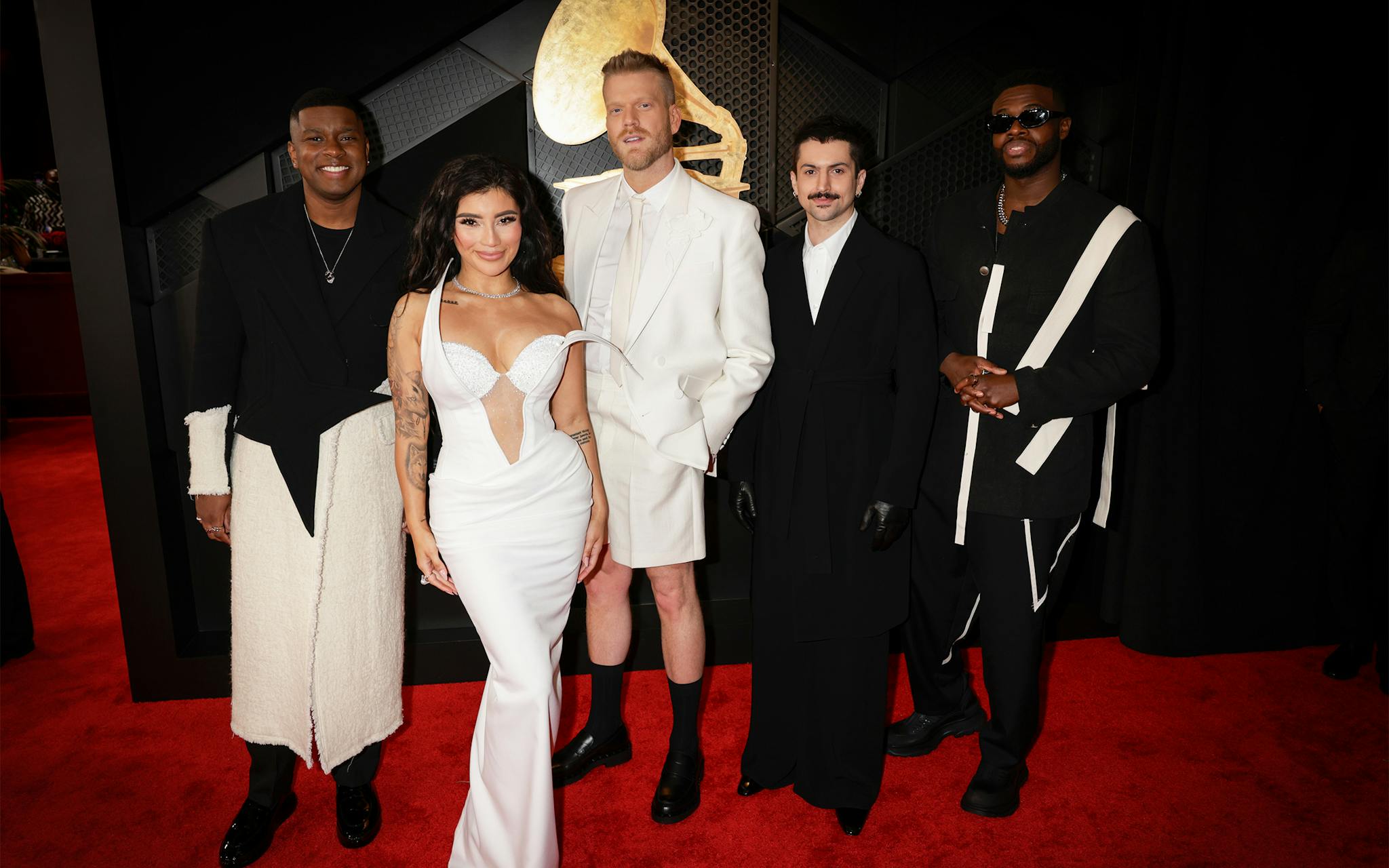 Pentatonix lost their Grammy to Icelandic artist Laufey, but the group still had their moment, performing Prince’s “Let’s Go Crazy"  alongside Jordin Sparks, Sheila E., Jaye Ivy and Larkin Poe. While their outfits were a cohesive win, as usual, their red carpet looks were bold choices. Matt Sallee, in particular, was a standout with his look that gave “when you have a spa appointment at 2 pm but the red carpet at 5 pm” with his black and white tuxedo-robe hybrid. 